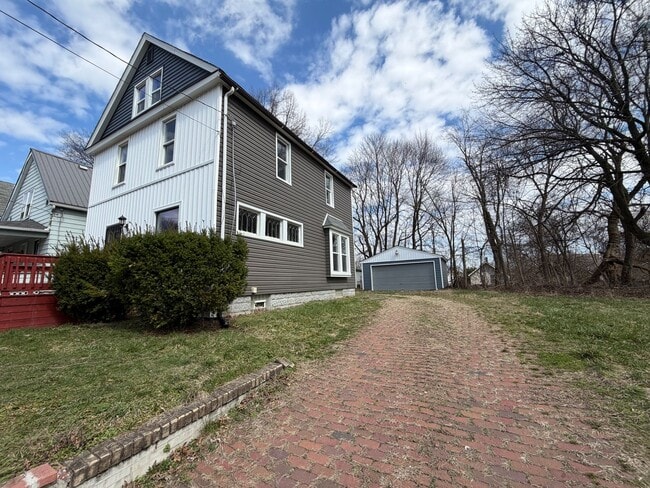 Photo - Charming Multi-Level Akron Home with Huge Living Room & Updated Siding