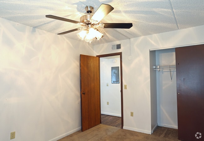 Master Bedroom with Ceiling Fan - Bonny Apartments