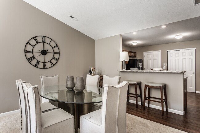 Enjoy meals and gatherings in a spacious dining area that flows seamlessly into the kitchen, designed for both comfort and convenience.
