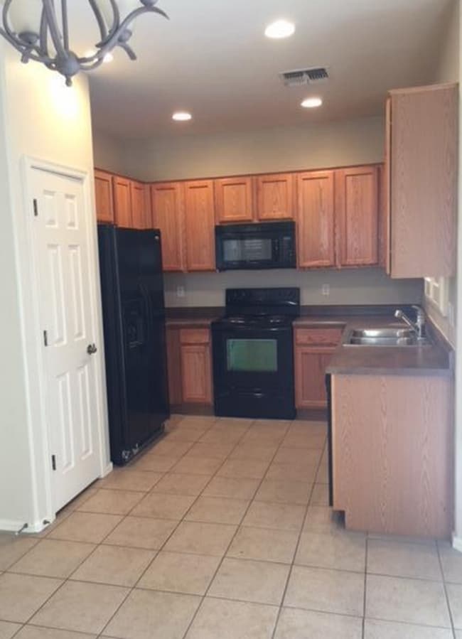 Photo - Adorable 2 story patio style with three spacious bedrooms and two full baths upstairs