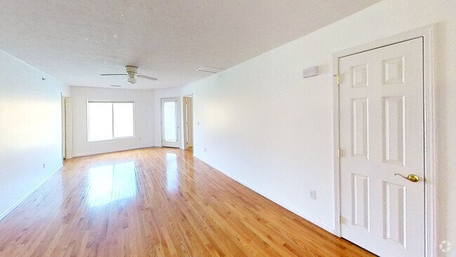 Living Room, large windows overlooking river - 7311 University Commons Dr Unit 7311 Rental