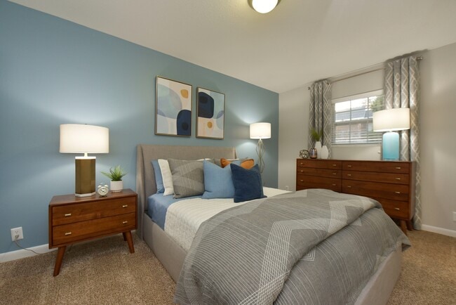 Cozy bedroom with carpet and overhead lighting