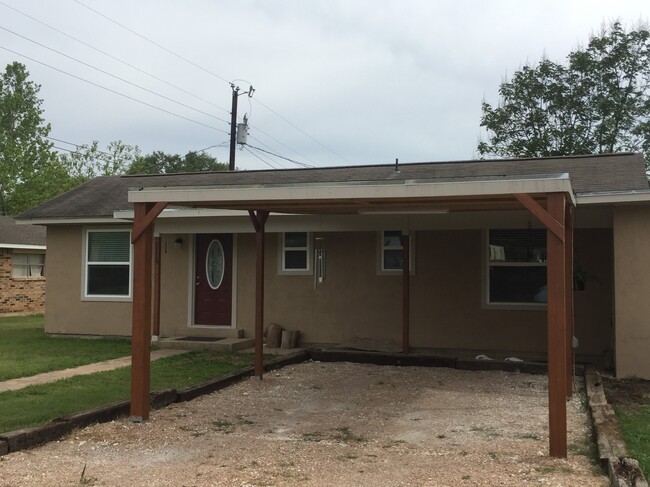 Covered carport parking - 1119 10th St. Townhome