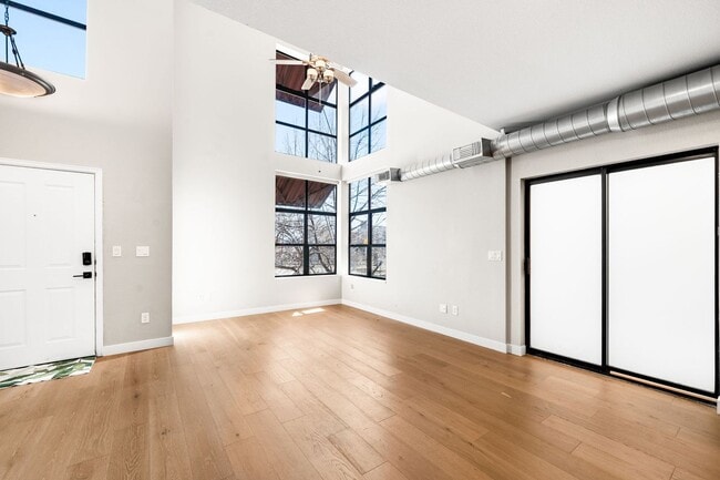 Photo - Modern 2BD, 1.5BA Condo with 20' Ceilings and Garage Parking Spot