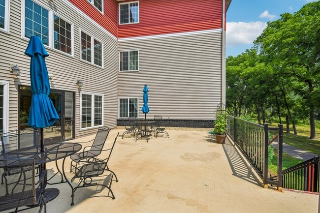 Unwind on the community patio at Mill Pond Apartments, perfect for outdoor lounging and entertaining in a tranquil setting. Enjoy the lush views and ample space for relaxation. Don't miss your chance to call this serene community home!