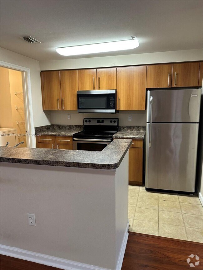 Building Photo - 5840 W Sample Rd Unit 306 Rental
