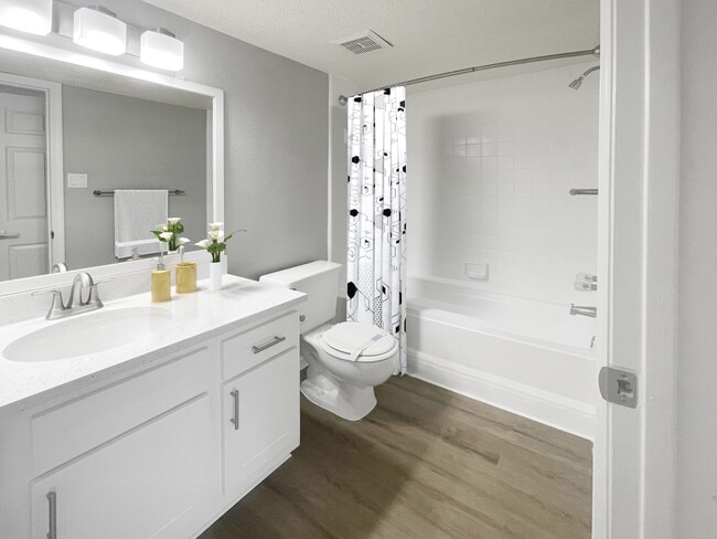 Upgraded Bathroom with White Cabinets
