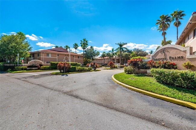 Building Photo - 3211 Sabal Palm Manor Unit 202