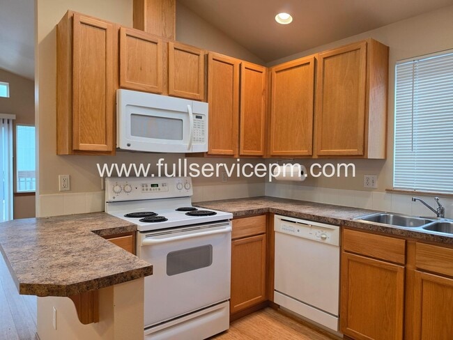 Photo - Private Drive Townhome Near Stone Ave N | 3 Bed, 2 Bath, 2-Car Garage, Deck + Fenced Yard