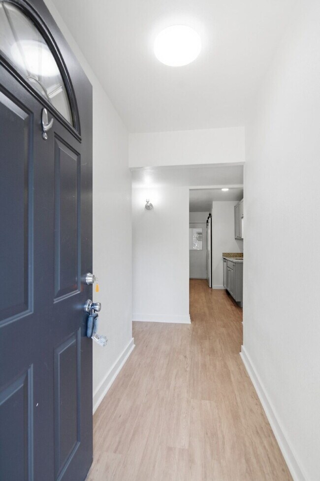 Photo - "Inviting 4/2/2 with Open Living, Flexible Spaces, and a Spacious Backyard!"