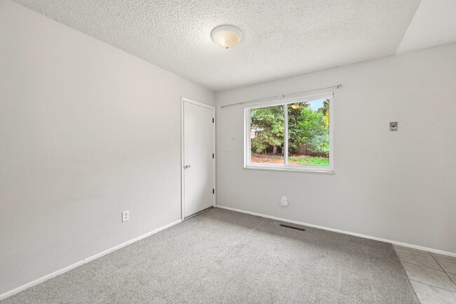 Photo - $1,945.95- 3-bed/1.5-bathroom home in Colorado Springs with a spacious fenced-in yard!