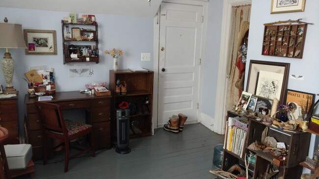 Living room looking toward entry door - 416 N Huron St Unit #3