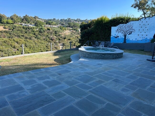 Backyard bluestone, in ground fountain/jacuzzi and rock climbing wall. - 27078 Sunnyridge Rd Rental