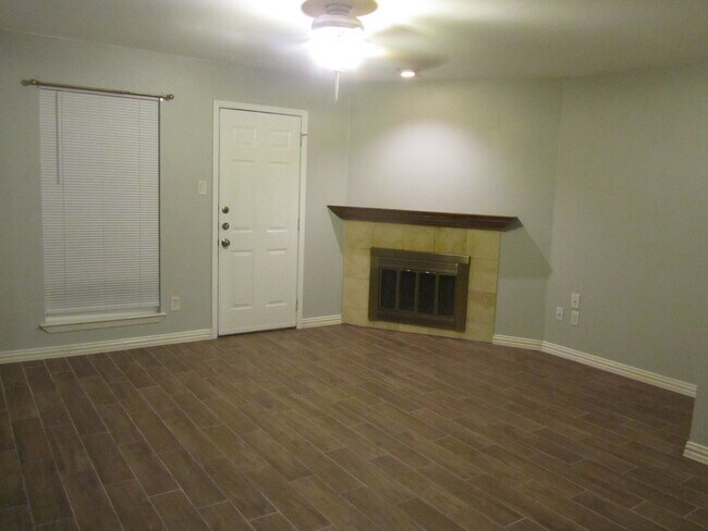 living and fireplace - 239 W Peach St Unit E