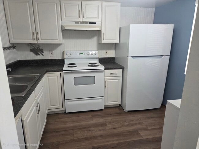 Kitchen with new refrigerator and icemaker - 100 Grand Blvd Unit 208