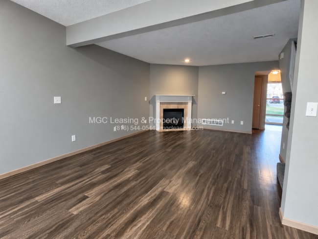 Inviting Harrisonville Townhome with Attached Garage & Cozy Fireplace