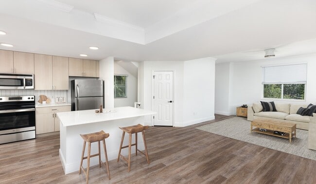 Spacious kitchen with an island that opens up to the living room