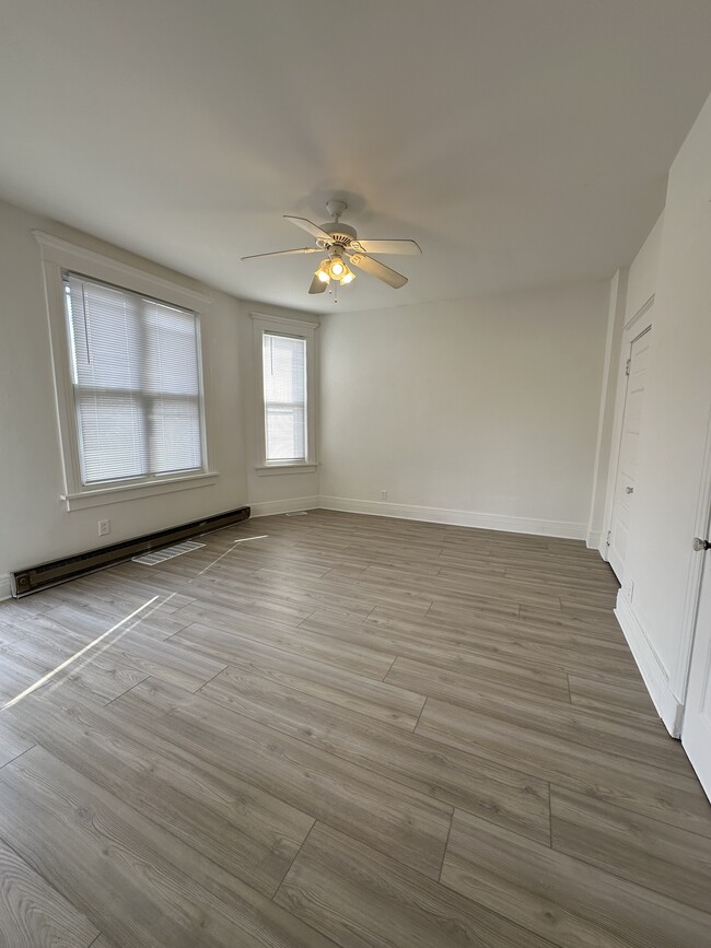 Large living space with abundant natural light. - 803 W Edwards St Apartments Unit F