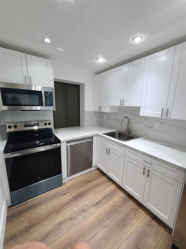 Building Photo - 17570 Atlantic Blvd Unit 501