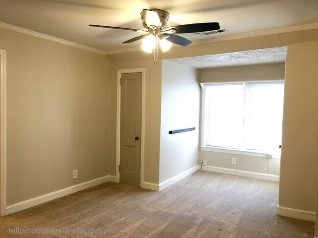 Living room with numerous closets - 629 Hillpine Dr NE