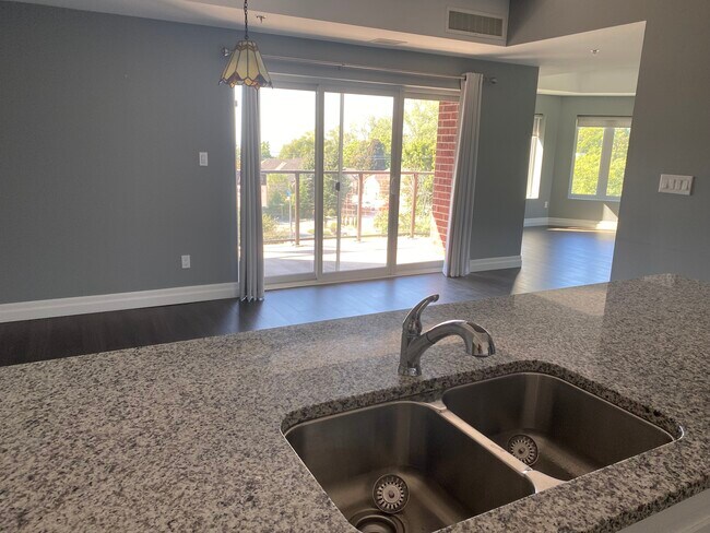 Nice sightlines into dining room and living room with 4 large windows. - 6 Park St Unit 301