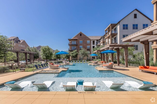 Infinity Pool with Sun Ledge & Lounge Seating - The Austin at Trinity Green Rental