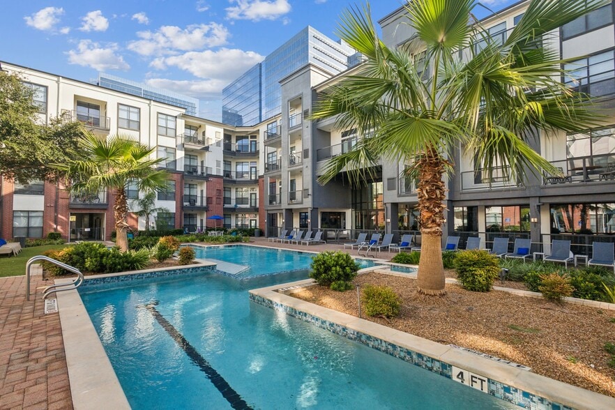 Resort-Inspired Pool with Sun Ledge, Lap Pool, and Waterfall