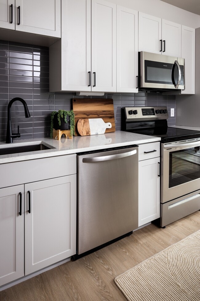 1 Bedroom Kitchen with stainless appliances and granite countertops