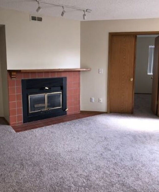 Photo - 2 BR/1BA | Newly Renovated Unit | Front Patio| Fireplace in living room!