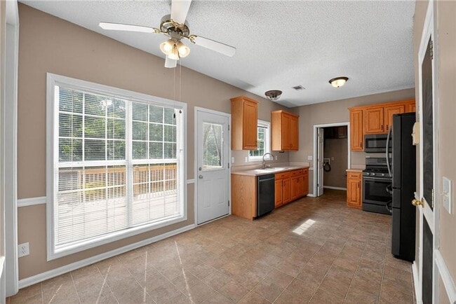 Photo - Spacious 5BR Home with Bonus Room & Private Backyard in Stockbridge