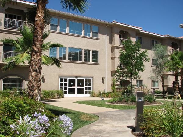 Walkway to building - Aurora Village II Senior Living 55+ Rental