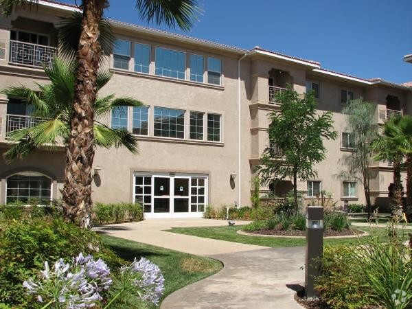 Walkway to building - Aurora Village II Senior Living 55+ Rental