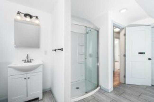 Photo - Renovated 4BR with In-Unit Laundry Near Moody Street