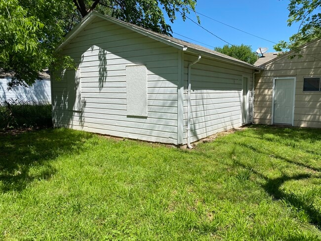 Backyard, looking toward garage and back door. - 508 E Indian Dr