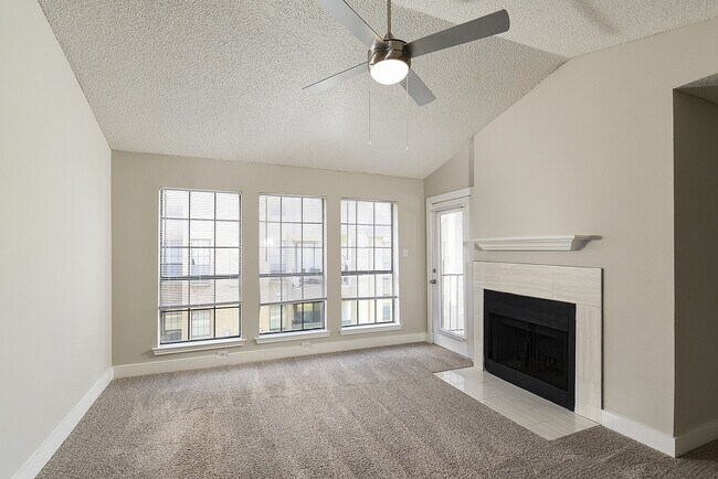 One Bedroom A3 - Living Area with Vaulted Ceiling and Fireplace