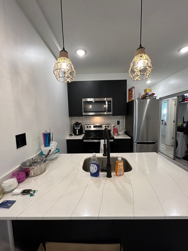 Photo - Private fenced yard! Modern, stylish & fully updated apartment! Unit 1E