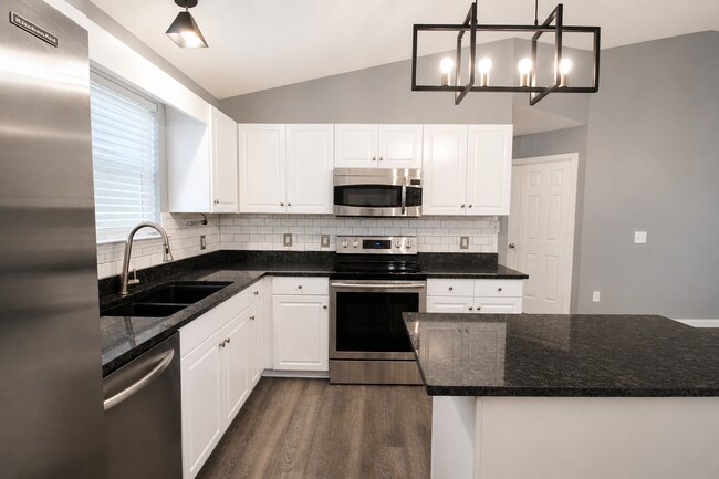 Photo - Updated 3BR/2BA Solar Home with No Carpet, Granite Countertops, Stainless Appliances & Spacious B...