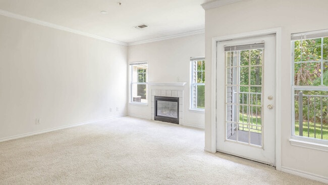 Living Room with Fireplace and Balcony - Liberty Park