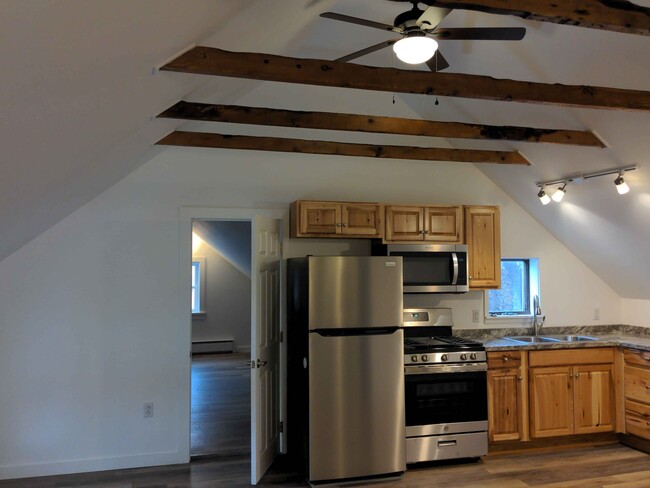 Style G1: 2 bedrooms / 1 bath, historic renovation, exposed beams and vaulted ceilings - 21 Depot St Apartments