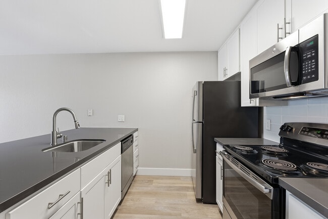 Your gourmet kitchen features brushed nickel finishes and generous storage.