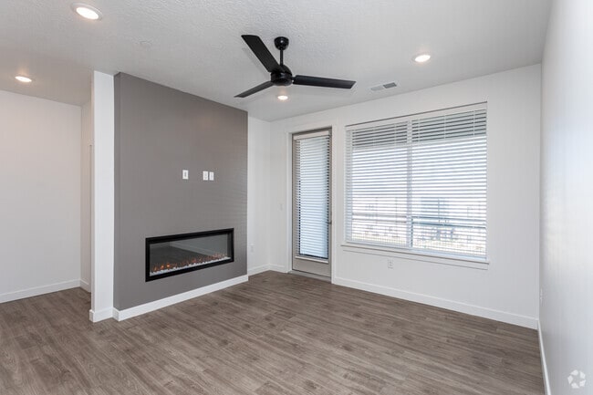 2BR, 2BA - 1116SF - Sala de estar - Reveal Apartments & Townhomes