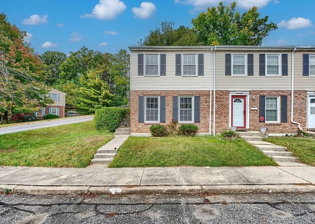 Photo - Updated End-of-Group Townhome with Finished Lower Level, Fenced Yard & Community Pool
