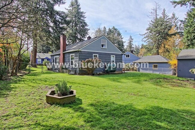 Photo - 4 Bedroom, 2 Bath Home with Primary on Main Floor, Basement and Large Fenced Yard