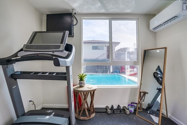 Mini Gym - Retro Style Apartment Building with Pool and Gym - Secure, Modern and Lease-Ready!