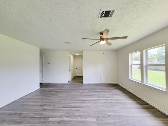 Photo - This fully renovated 3-bedroom, 2-bath home features a modern kitchen, large master suite with a ...