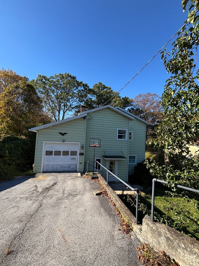 Photo - Charming 2-Bedroom Single-Family Home with Garage and Off-Street Parking