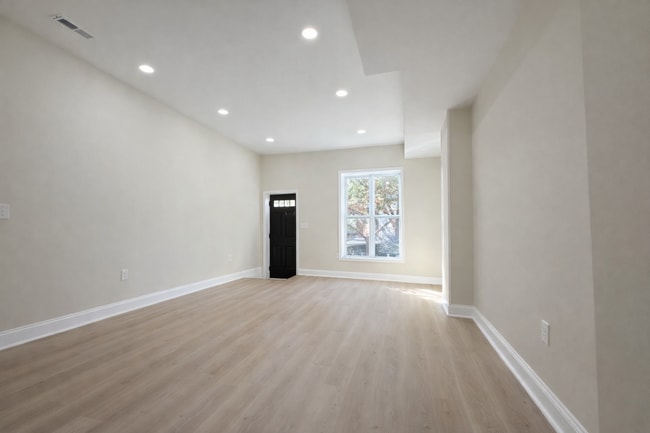 Photo - Modern 3BR Rowhome with Finished Lower Level & Rear Deck