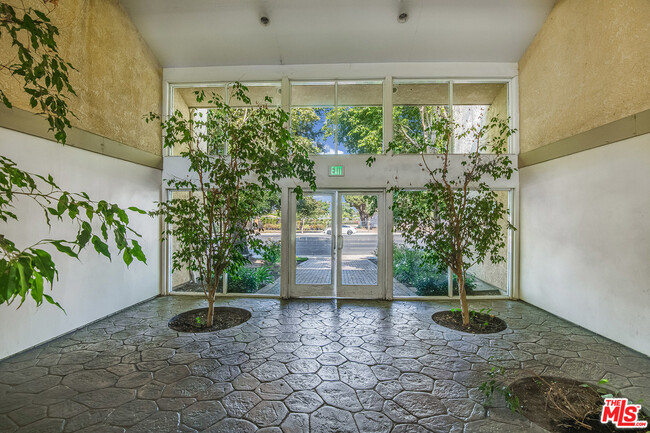 Front Entrance to Building - Doors are locked and secured 24 hours - 7800 Topanga Canyon Blvd Condo Unit 206