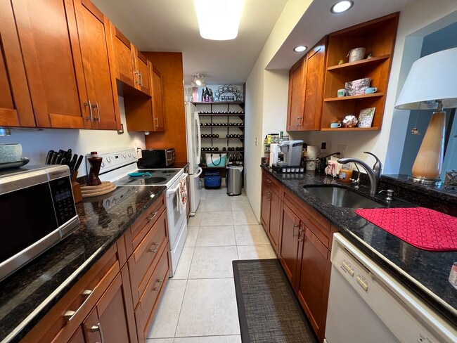 Kitchen w Wine/Book Shelves - 777 S Federal Hwy Unit RP701