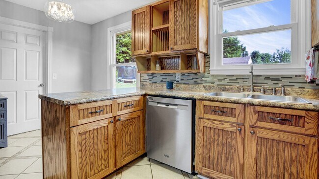 Photo - For Rent : 4BR, 1 1/2BA home with fenced in back yard and storage building.